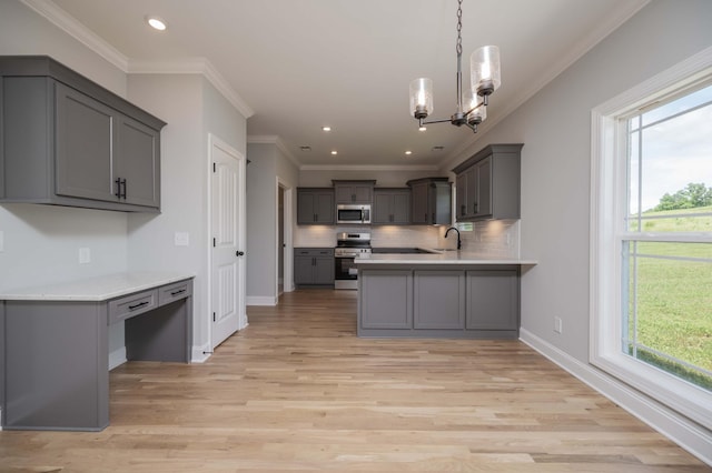 135 Bruce Meadows Dr, Beechgrove, TN 37018 - kitchen with stainless steel appliances, gray cabinetry, plenty of natural light, ornamental molding, and recessed lighting