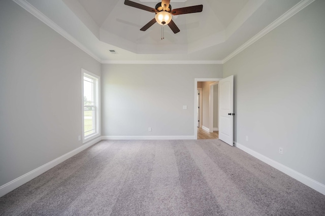 135 Bruce Meadows Dr, Beechgrove, TN 37018 - empty room with a tray ceiling, ceiling fan, carpet floors, and crown molding