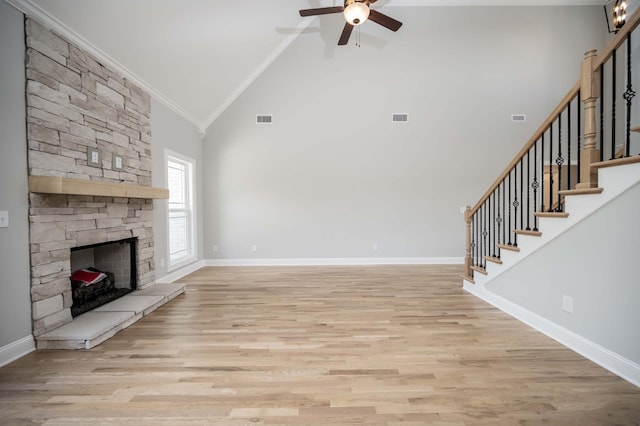 135 Bruce Meadows Dr, Beechgrove, TN 37018 - unfurnished living room with ornamental molding, high vaulted ceiling, a ceiling fan, stairs, and light wood-style floors