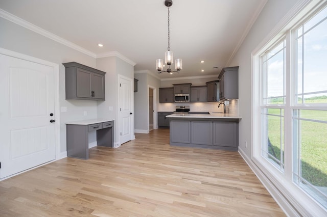 135 Bruce Meadows Dr, Beechgrove, TN 37018 - kitchen featuring stainless steel appliances, gray cabinets, a chandelier, crown molding, and light wood-type flooring