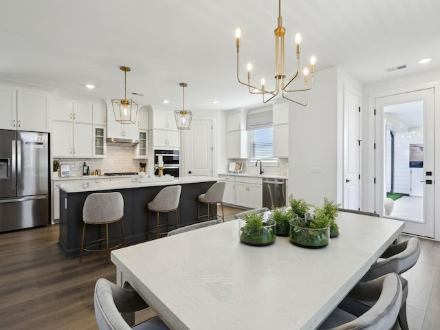 7019 Chardon St, Franklin, TN 37067 - dining room with a chandelier, recessed lighting, and dark wood finished floors