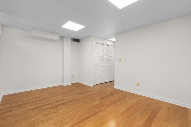 2411 Woolson Rd, Chattanooga, TN 37406 - empty room with light wood finished floors and a drop ceiling