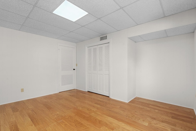 2411 Woolson Rd, Chattanooga, TN 37406 - below grade area with a paneled ceiling and light wood-style flooring