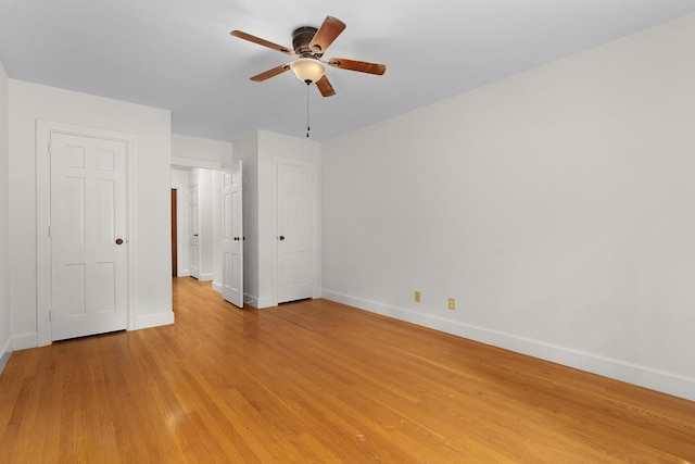 2411 Woolson Rd, Chattanooga, TN 37406 - unfurnished bedroom with light wood finished floors and ceiling fan