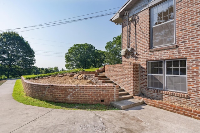 2411 Woolson Rd, Chattanooga, TN 37406 - view of home's exterior with stairway and brick siding