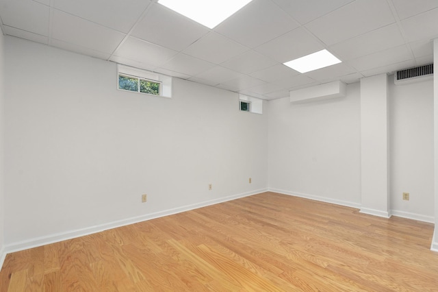 2411 Woolson Rd, Chattanooga, TN 37406 - below grade area featuring light wood-type flooring and a paneled ceiling