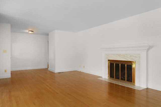 2411 Woolson Rd, Chattanooga, TN 37406 - unfurnished living room with wood finished floors and a high end fireplace