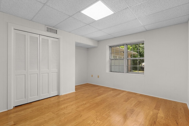 2411 Woolson Rd, Chattanooga, TN 37406 - unfurnished bedroom with a drop ceiling, light wood finished floors, and a closet