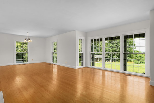 2411 Woolson Rd, Chattanooga, TN 37406 - spare room featuring a chandelier and light wood finished floors