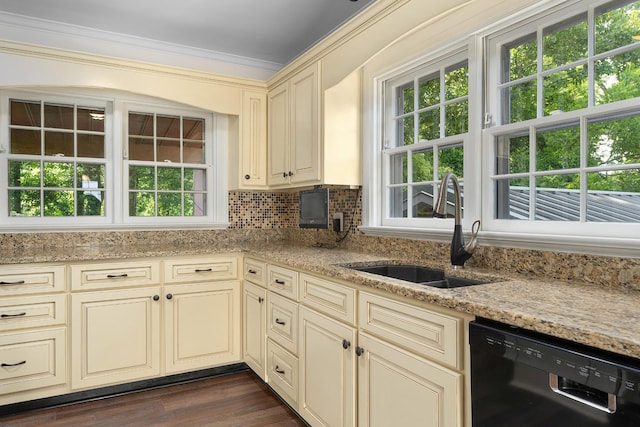 2411 Woolson Rd, Chattanooga, TN 37406 - kitchen featuring black dishwasher, cream cabinets, light stone countertops, decorative backsplash, and crown molding