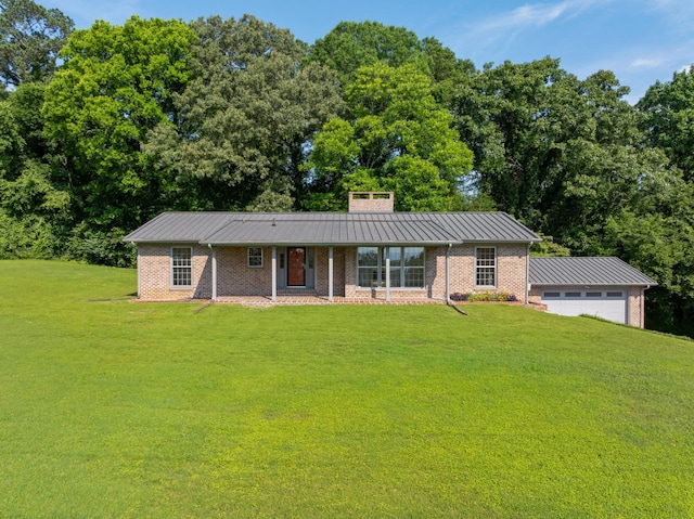 2411 Woolson Rd, Chattanooga, TN 37406 - ranch-style home with a front yard, brick siding, a standing seam roof, a chimney, and a metal roof