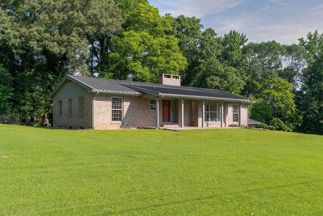 2411 Woolson Rd, Chattanooga, TN 37406 - ranch-style house featuring covered porch, a front lawn, brick siding, and a chimney