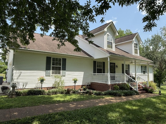 3330 Booker Farm Rd, Mount Pleasant, TN 38474 - view of front of house featuring covered porch, a front yard, and roof with shingles