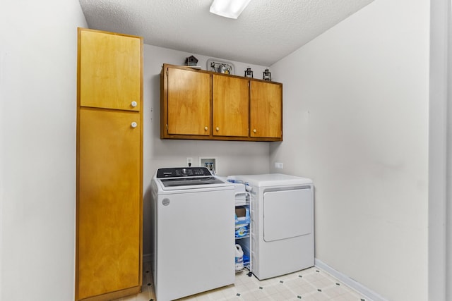 3330 Booker Farm Rd, Mount Pleasant, TN 38474 - laundry area featuring cabinet space, separate washer and dryer, a textured ceiling, and light flooring