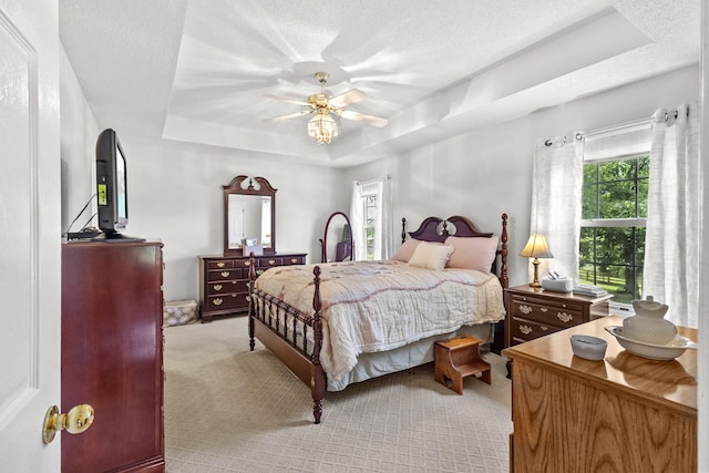 3330 Booker Farm Rd, Mount Pleasant, TN 38474 - bedroom featuring a tray ceiling, light carpet, and ceiling fan
