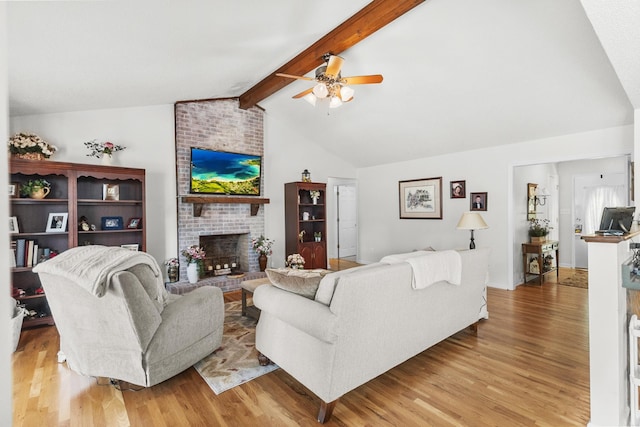 3330 Booker Farm Rd, Mount Pleasant, TN 38474 - living room featuring a brick fireplace, a ceiling fan, and light wood-type flooring