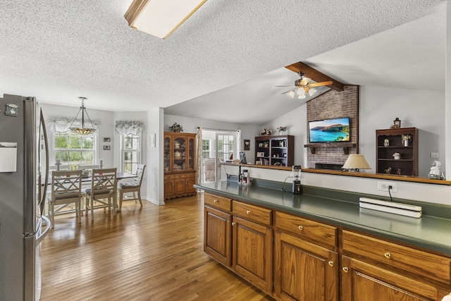3330 Booker Farm Rd, Mount Pleasant, TN 38474 - kitchen featuring freestanding refrigerator, a textured ceiling, light wood-type flooring, dark countertops, and a ceiling fan
