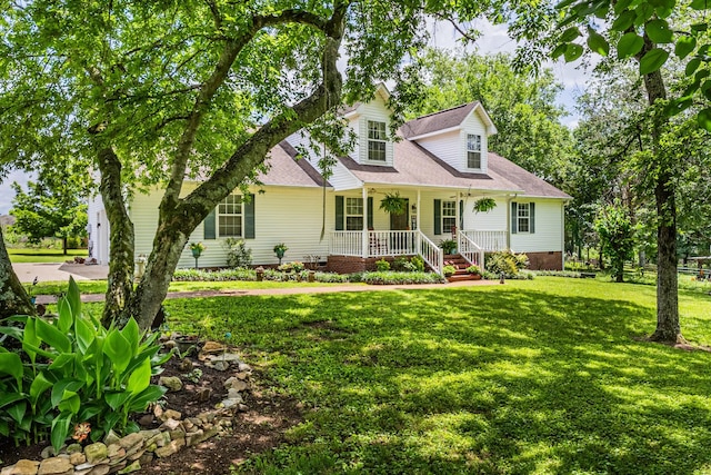 3330 Booker Farm Rd, Mount Pleasant, TN 38474 - cape cod-style house with covered porch, crawl space, a front lawn, a shingled roof, and concrete driveway