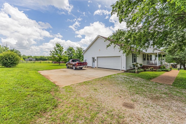 3330 Booker Farm Rd, Mount Pleasant, TN 38474 - view of property exterior featuring covered porch, driveway, a yard, and an attached garage