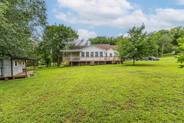 3330 Booker Farm Rd, Mount Pleasant, TN 38474 - rear view of property with a wooden deck, a yard, and a chimney