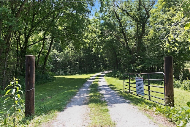 189 Cross Creek Dr, Manchester, TN 37355 - view of street featuring a gate and a forest view