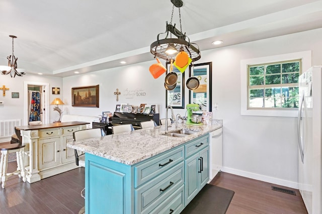 189 Cross Creek Dr, Manchester, TN 37355 - kitchen featuring white appliances, blue cabinetry, dark wood-style floors, a peninsula, and lofted ceiling