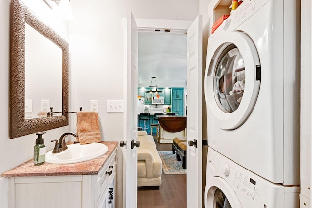189 Cross Creek Dr, Manchester, TN 37355 - washroom featuring stacked washer and clothes dryer and wood finished floors