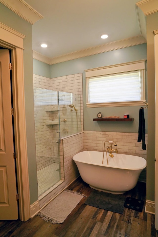 450 Lowe Branch Rd, Centerville, TN 37033 - bathroom with crown molding, a shower stall, healthy amount of natural light, a soaking tub, and tile walls