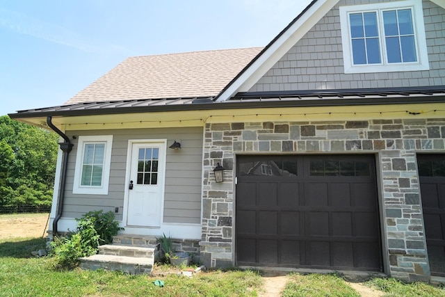 450 Lowe Branch Rd, Centerville, TN 37033 - view of front of house featuring a standing seam roof, entry steps, a metal roof, a garage, and stone siding