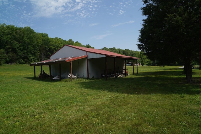 450 Lowe Branch Rd, Centerville, TN 37033 - view of pole building featuring a yard and a view of trees