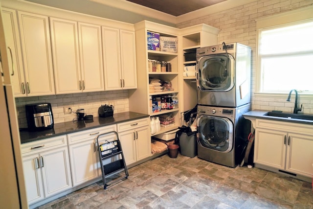 450 Lowe Branch Rd, Centerville, TN 37033 - washroom with estacked washer and dryer and stone finish floors