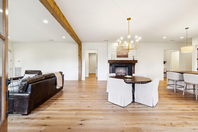 1249 Wilson School Rd, Chapel Hill, TN 37034 - dining room featuring light wood finished floors, a chandelier, a warm lit fireplace, recessed lighting, and beam ceiling