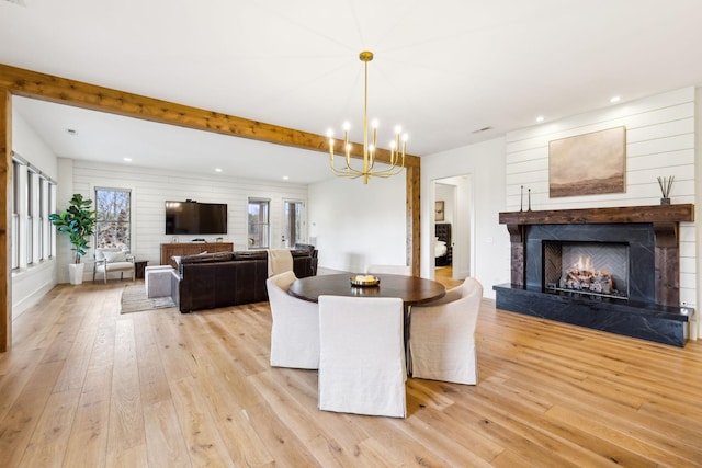1249 Wilson School Rd, Chapel Hill, TN 37034 - dining area with light wood finished floors, healthy amount of natural light, a lit fireplace, recessed lighting, and beam ceiling