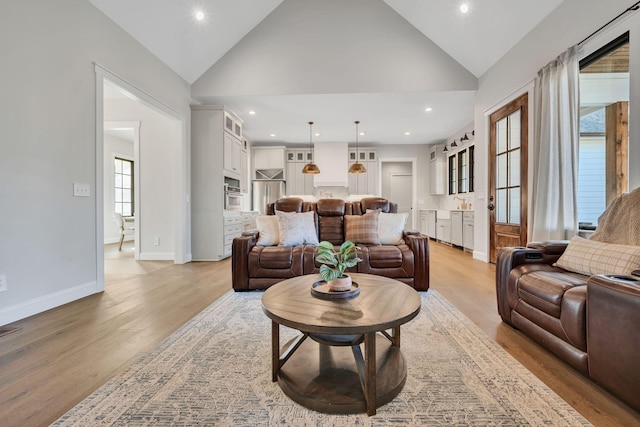 673 Billy Wynn Rd, Dickson, TN 37055 - living room with light wood-type flooring, lofted ceiling, and recessed lighting
