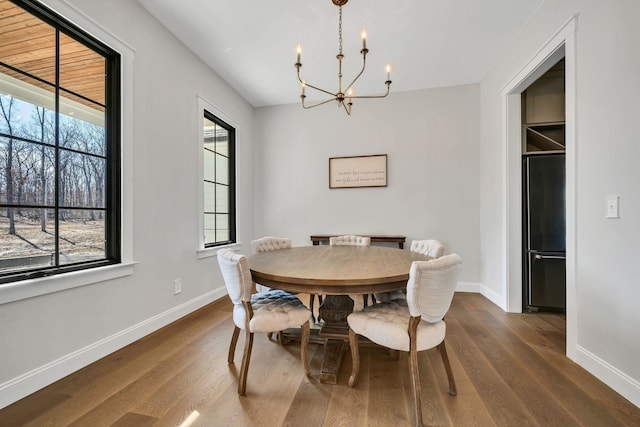673 Billy Wynn Rd, Dickson, TN 37055 - dining space featuring a chandelier, plenty of natural light, and dark wood-type flooring