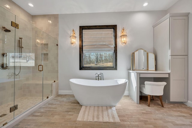 673 Billy Wynn Rd, Dickson, TN 37055 - full bathroom with a freestanding bath, a shower stall, recessed lighting, and plenty of natural light