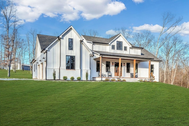 673 Billy Wynn Rd, Dickson, TN 37055 - modern inspired farmhouse featuring a porch, board and batten siding, a front lawn, and roof with shingles