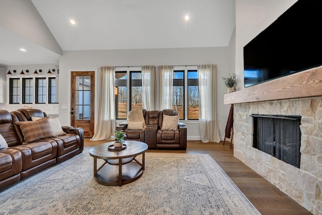 673 Billy Wynn Rd, Dickson, TN 37055 - living area with wood finished floors, healthy amount of natural light, recessed lighting, a stone fireplace, and high vaulted ceiling