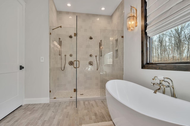 673 Billy Wynn Rd, Dickson, TN 37055 - bathroom with a freestanding bath, a shower stall, and recessed lighting