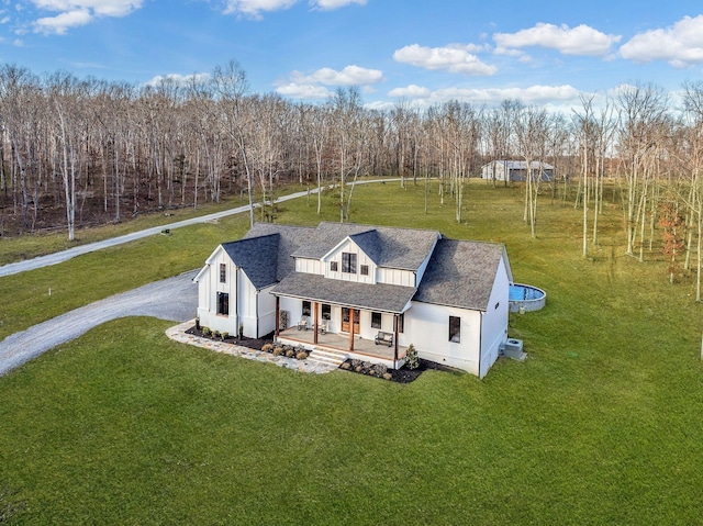 673 Billy Wynn Rd, Dickson, TN 37055 - view of front of property with covered porch, a front yard, and roof with shingles