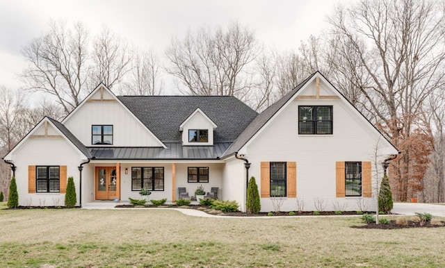1036 Wilderness Way, Cottontown, TN 37048 - modern farmhouse featuring a standing seam roof, a front lawn, a porch, and a metal roof