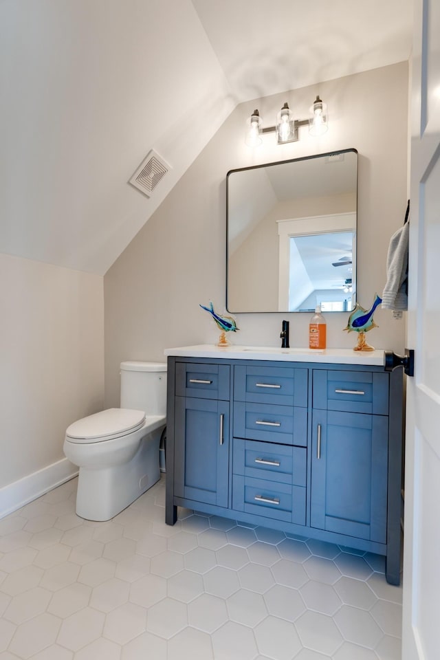 1036 Wilderness Way, Cottontown, TN 37048 - bathroom featuring lofted ceiling, vanity, and tile patterned flooring