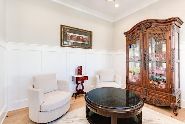 1036 Wilderness Way, Cottontown, TN 37048 - sitting room featuring light wood finished floors, a decorative wall, a wainscoted wall, crown molding, and recessed lighting