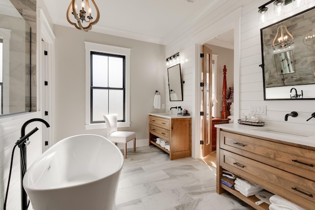 1036 Wilderness Way, Cottontown, TN 37048 - full bathroom featuring a chandelier, two vanities, a freestanding tub, and crown molding