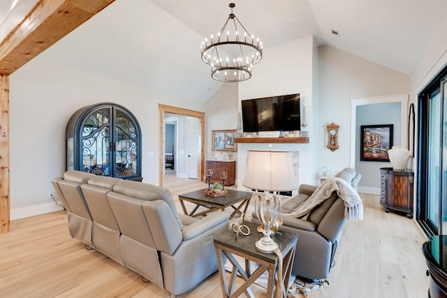 1036 Wilderness Way, Cottontown, TN 37048 - living room with a chandelier, light wood-style floors, and high vaulted ceiling