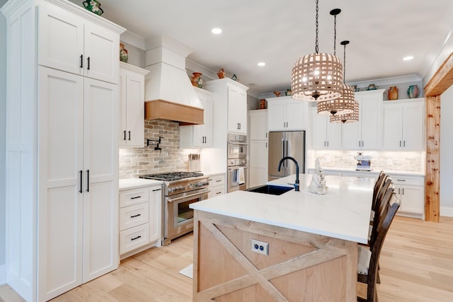 1036 Wilderness Way, Cottontown, TN 37048 - kitchen featuring appliances with stainless steel finishes, premium range hood, a chandelier, light wood-type flooring, and recessed lighting