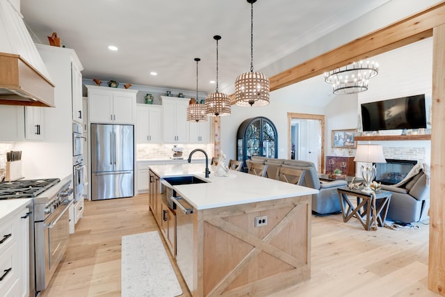 1036 Wilderness Way, Cottontown, TN 37048 - kitchen with stainless steel appliances, custom exhaust hood, a chandelier, light wood-style floors, and recessed lighting