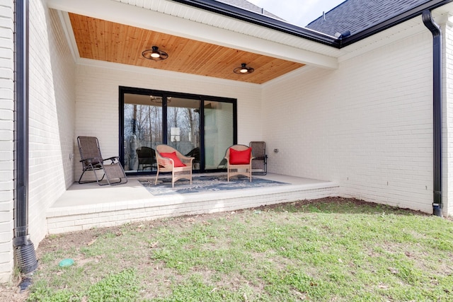 1036 Wilderness Way, Cottontown, TN 37048 - entrance to property with brick siding, a yard, a patio area, and roof with shingles