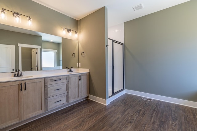 1189 Goose Dr, Springfield, TN 37172 - full bathroom with double vanity, a shower stall, and wood finished floors