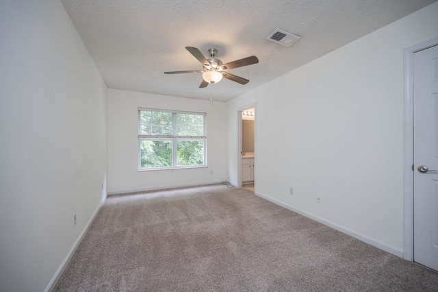 482 Flintlock Ct, Nashville, TN 37217 - spare room featuring light colored carpet, a ceiling fan, and a textured ceiling